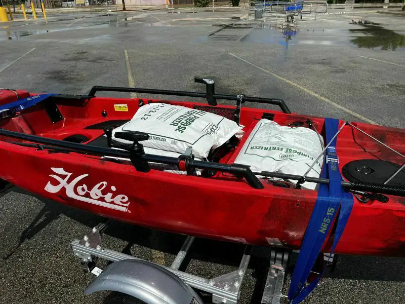 Fertilizer bags in kayak trailer for stability